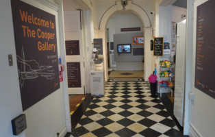 A path leading to the Cooper Cafe on the right and the gift shop on the left