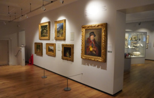 One of the galleries at The Cooper Gallery with many different artworks on display