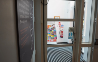 An automatic door that leads to the back entrance of The Cooper Gallery